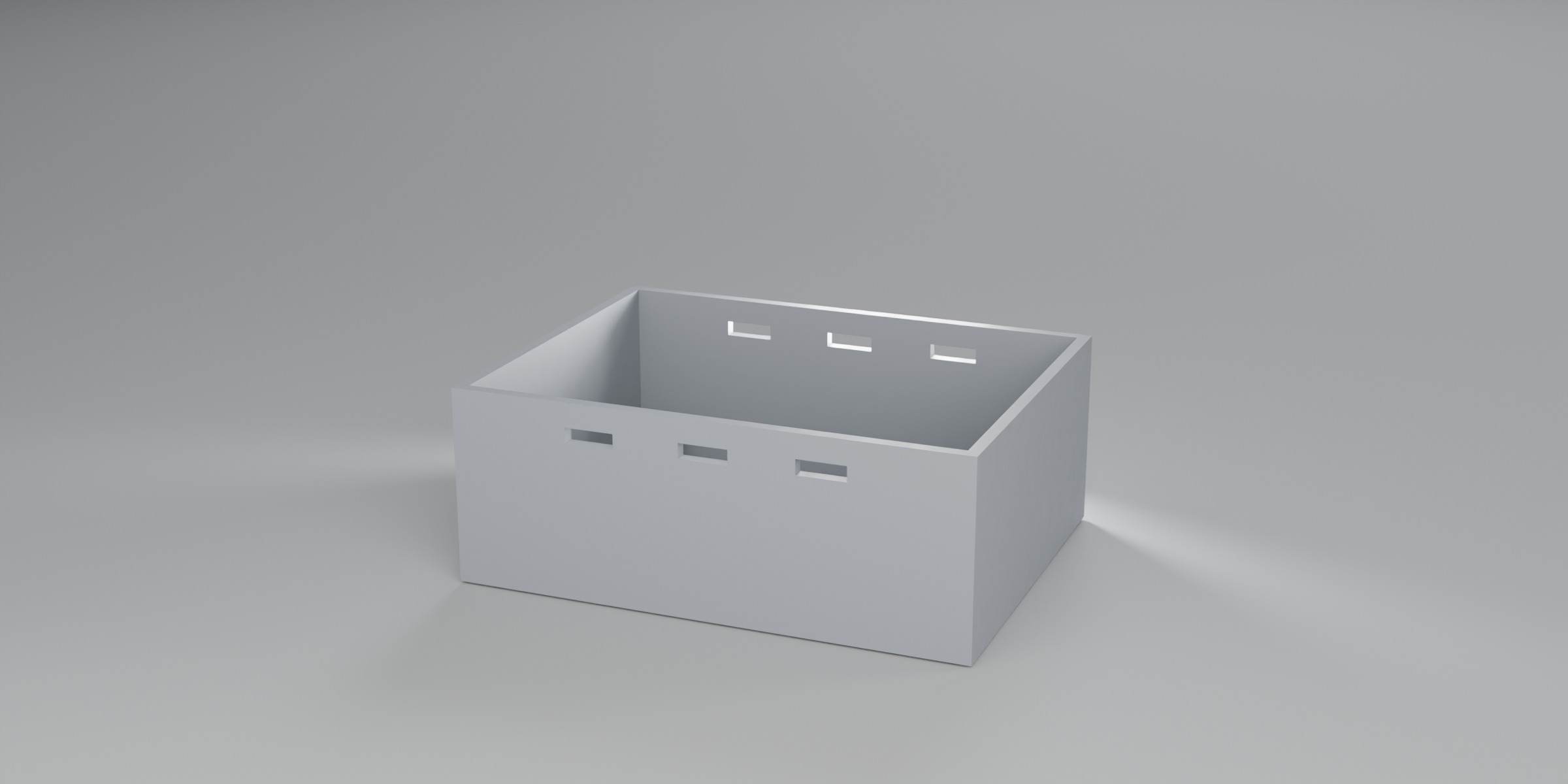 Long wall of the box with rectangular vent slots cut through.